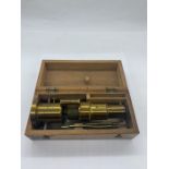 A cased brass microscope