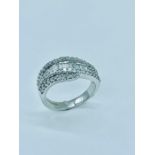 A contemporary diamond ring comprising 25 baguette cut diamonds colour G/H clarity VS2/SI1 ) 0.5