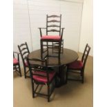 An Ercol gateleg dining table and six dining chairs to include two carvers, Approx dimensions when