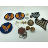 A Selection of WWII Military Items to include dog tag's, RAF insignia, two USA 8th Army Airforce