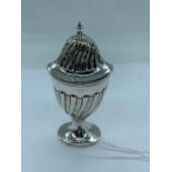 A silver pepper pot, hallmarked Birmingham.