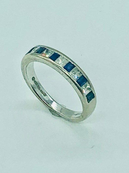 An 18 ct white gold half eternity ring with diamonds and sapphires. - Image 2 of 5