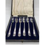 A boxed set of six hallmarked silver cake forks 1908 maker's mark JM.