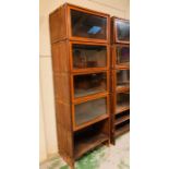 A Mahogany Sectional Bookcase with up and over glass doors to each section, in a Globe Wernicke