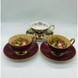 A selection of three cups and saucers by Aynsley and Elizabethan