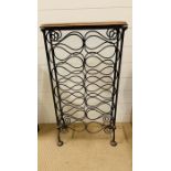 A wrought iron wine rack