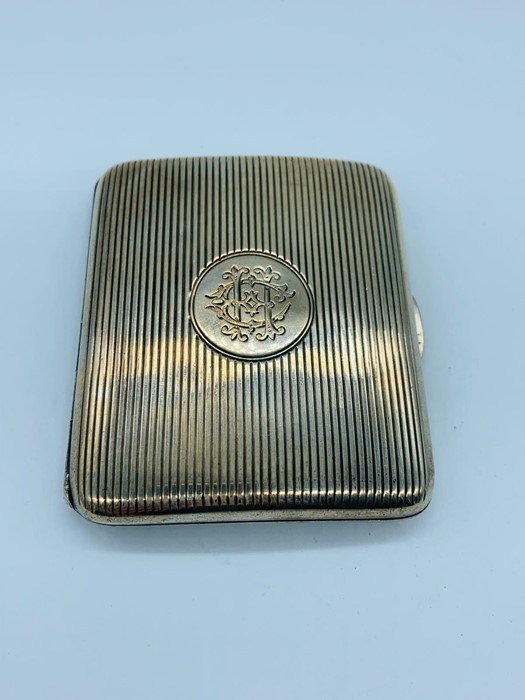 A silver cigarette case, hallmarked London 1899.