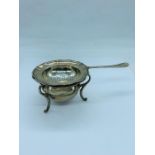 A silver tea strainer on a stand, continental.