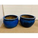 A pair of blue glazed garden pots