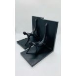 A pair of contemporary black bookends