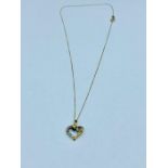 A 9 ct gold heart pendant and chain (1.5g)