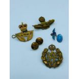 A small collection of RAF cap badges insignia and buttons