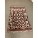 A Turkish hand made rug with tassels to both ends from the Estate of Sheikh Mustafa Edrees