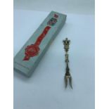 A boxed 1960's silver Dutch windmill cocktail fork with moving part