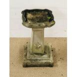 A weathered stone bird bath with fleur-de-lis detailing (H45cm)