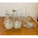 A large selection of glassware to include decanters, bowls, water jugs and vases