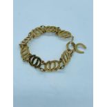 A horseshoe themed 9 ct gold bracelet (14g)