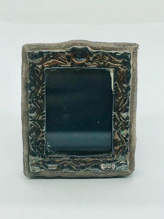 A miniature silver frame hallmarked London, maker's mark K.F ltd