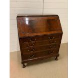 A Bureau desk with drawers under.