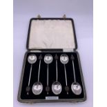 A boxed set of hallmarked silver coffee spoons.