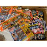 A large selection of Doctor Who Adventures magazines some with gifts in original packaging