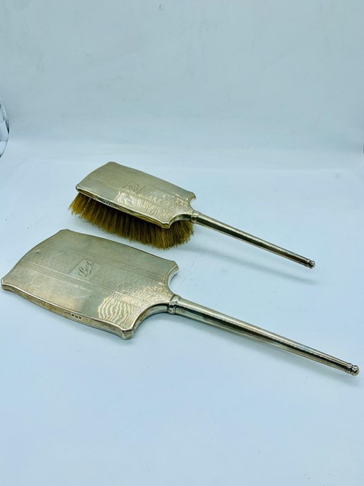 Silver dressing table brush and mirror, hallmarked Birmingham 1934 by DM Co.