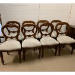 Eight Victorian open back mahogany dining chairs on turned and fluted legs