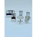 A selection of six items of silver dolls house furniture