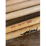 A selection of drum sticks some signed by Neal Smith