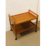 A Danish teak drinks trolley on castors