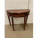 A Demi Lune Hall table on reeded legs