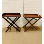 A pair of butlers trays on stands