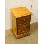 A pine bedside cabinet