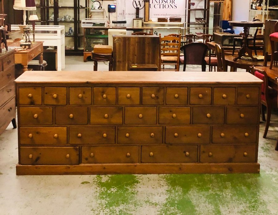 A spectacular pitch pine apothecary cabinet containing twenty six drawers in total (H90cm D50cm