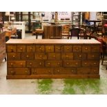 A spectacular pitch pine apothecary cabinet containing twenty six drawers in total (H90cm D50cm