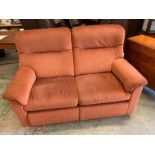 A reclining two seater sofa
