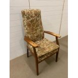 A Parker Knoll high backed arm chair