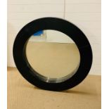 A large round black mirror (112cm x 112cm)