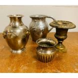 Four white metal vases