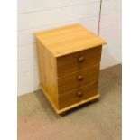 A wooden bedside cabinet