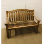 A solid wooden garden bench (W123cm)