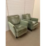 Two green arm chairs