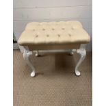 A vanity stool with cream button seat pad and cabriole legs (56cm x 48cm)