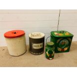 A selection of metal vintage bread bins and urns