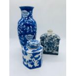 Three blue and white oriental decorative vases and ginger jar