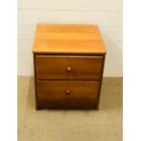 A pair of modern pine bedside cabinet