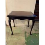 A small side table with centre drawer