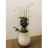 A large plaster pot with artificial flower arrangement (Pot height 66cm)