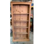 A pine tall open plan bookcase