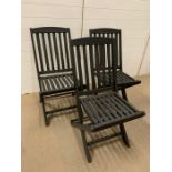 Three black wooden garden chairs